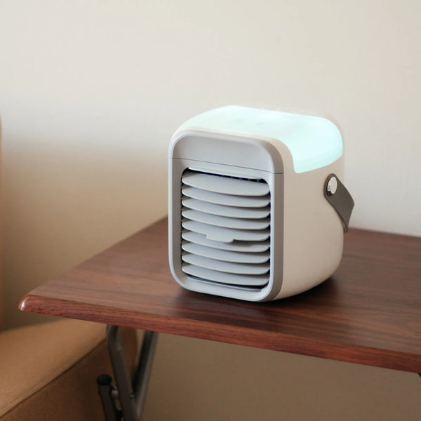 White and grey air cooler positioned on a table