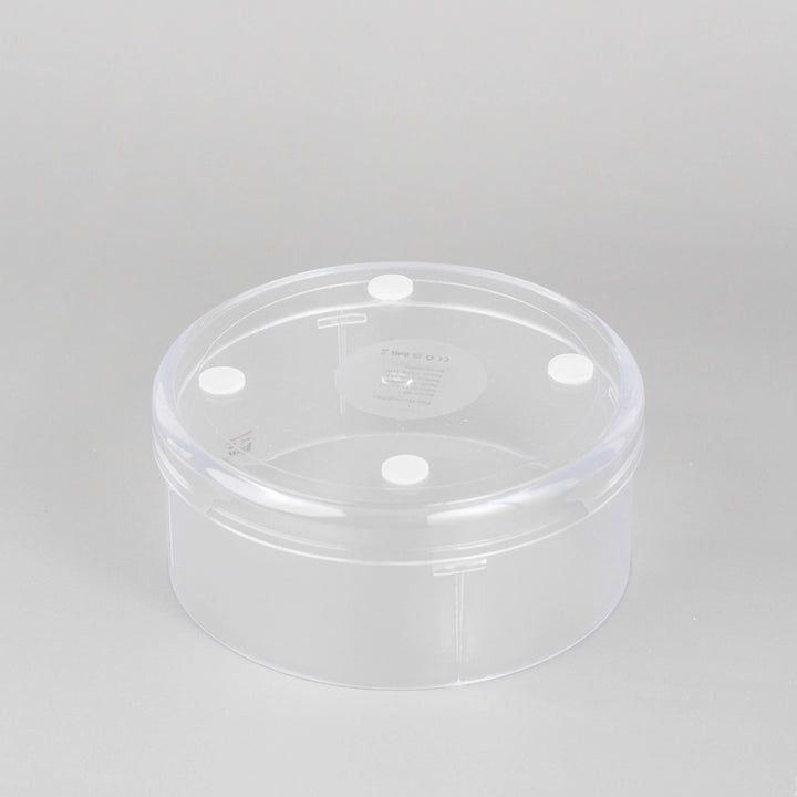 Foldable Fan Humidifier in a clear plastic container on a white surface