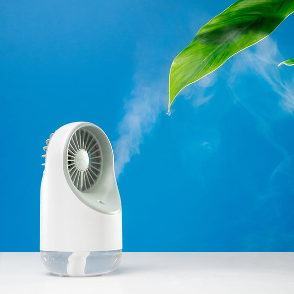 Mini fan humidifier with a green leaf against a blue backdrop