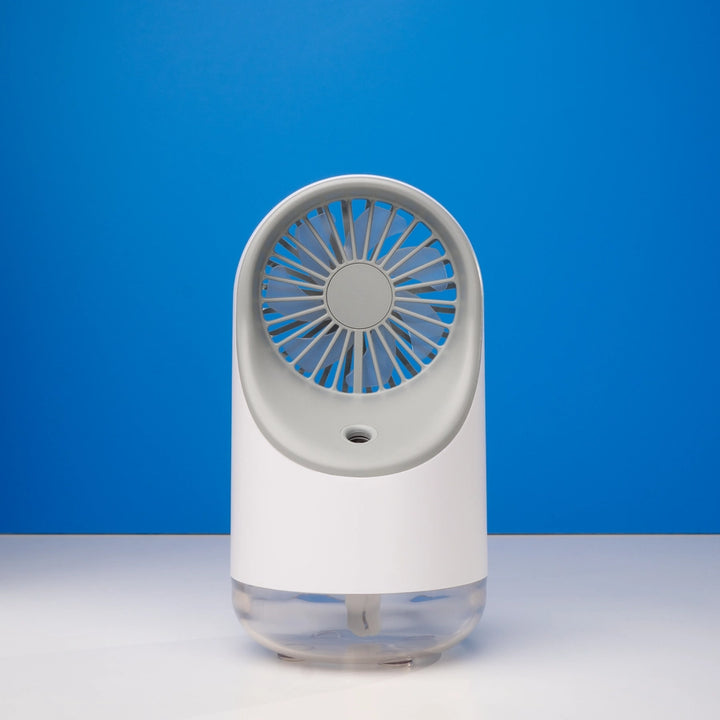 White mini fan humidifier placed on a table