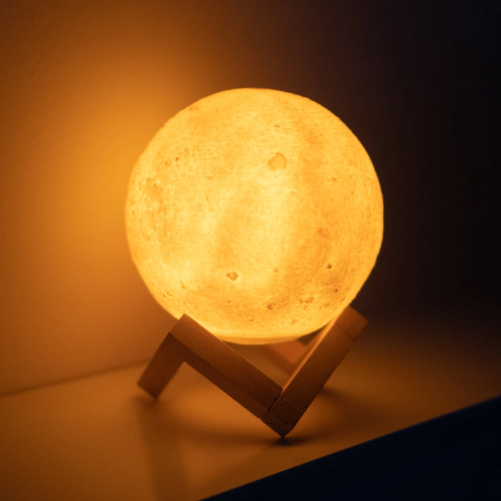 Moon lamp humidifier showcased on a wooden stand