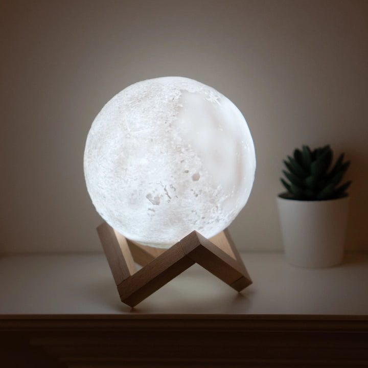 Moon lamp humidifier positioned on a wooden base