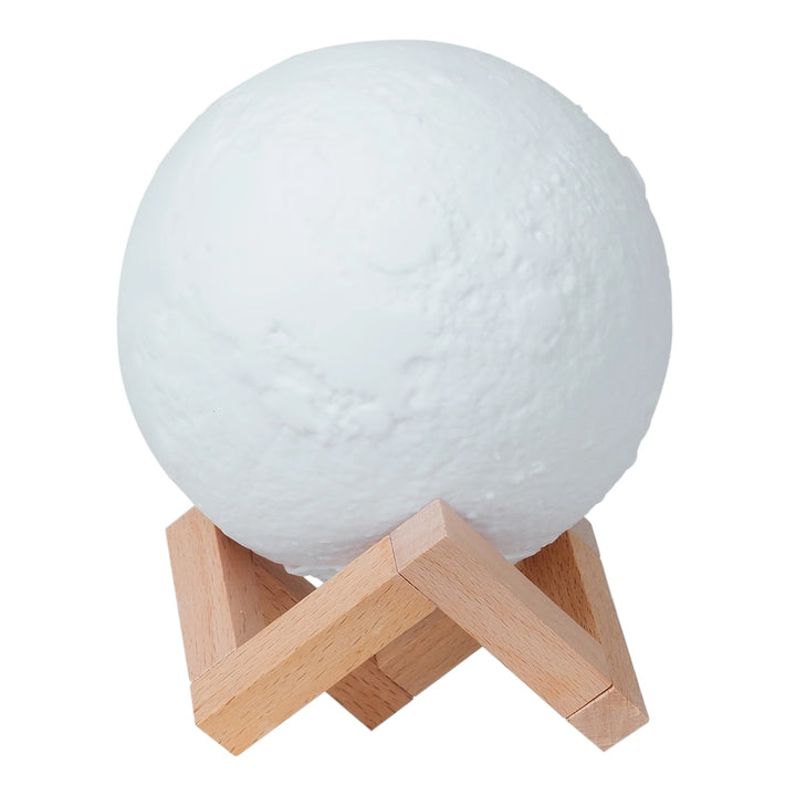 White moon-shaped humidifier lamp on a wooden stand